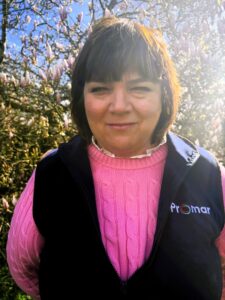 Portrait of Alex Platt, South West Regional Manager for the Farm Business Survey, standing outdoors.